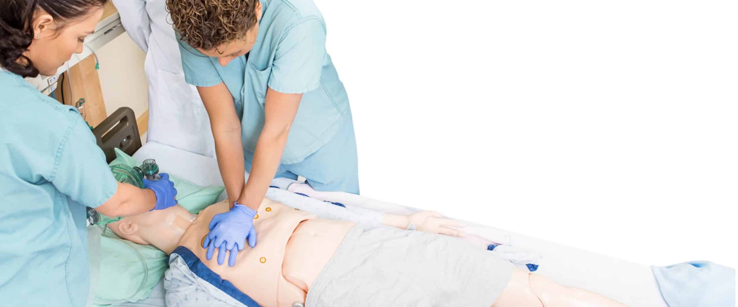 Healthcare providers performing basic life support to a human dummy