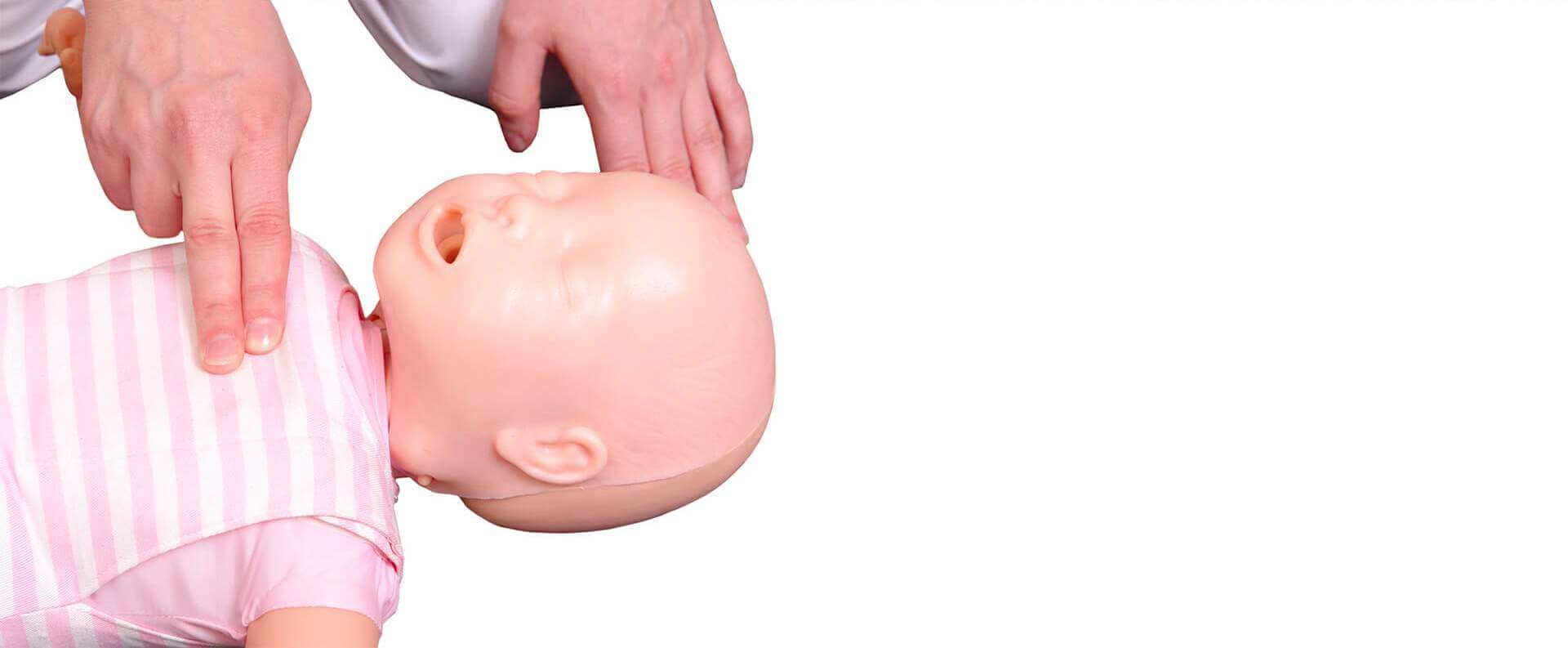 Close up of hands performing a CPR on a baby